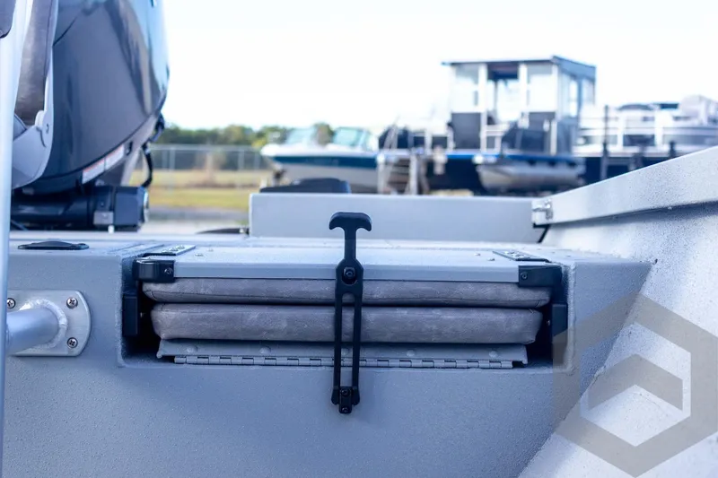 Slide: The Image of 2026 G3 Bay 19 GX boat with folded seat and motor, docked outdoors. - 38