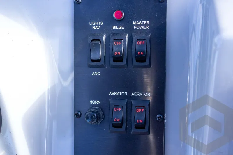 Slide: The Image of Control panel of G3 Bay 19 GX boat, featuring switches for lights, bilge, and aerator. - 46