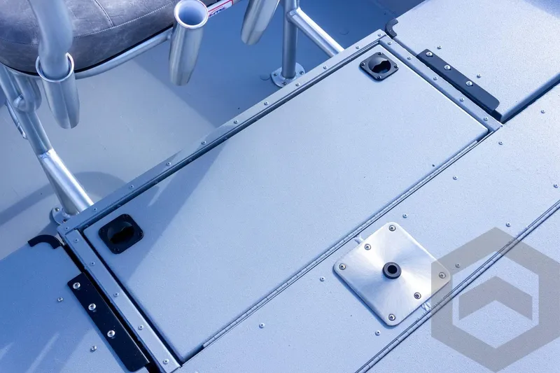 Slide: The Image of 2026 G3 Bay 19 GX boat deck with storage compartment and seating area. - 51