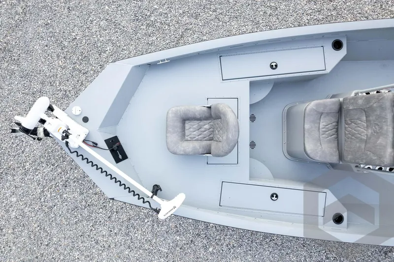 Slide: The Image of Top view of 2026 G3 Bay 19 GX boat with gray seating and trolling motor. - 54