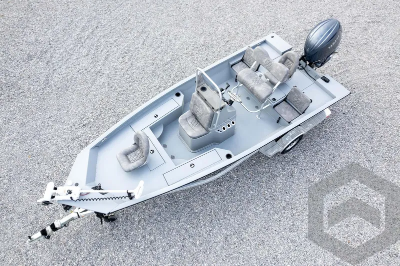 Slide: The Image of 2026 G3 Bay 19 GX fishing boat with seating and motor on gravel surface. - 57