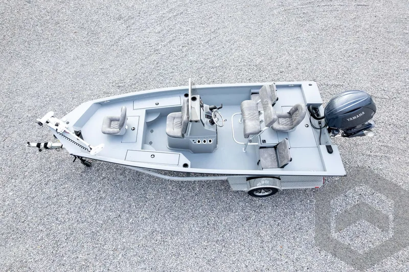 Slide: The Image of 2026 G3 Bay 19 GX boat with Yamaha motor, aerial view on gravel surface. - 58