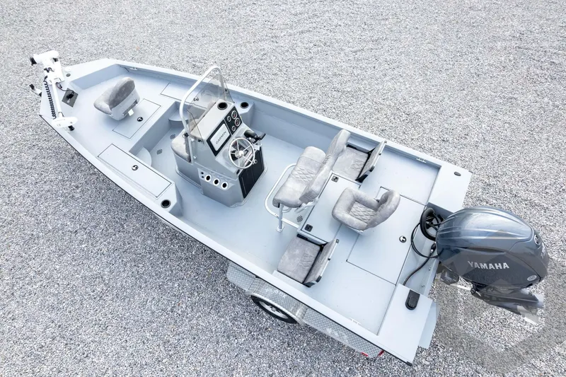 Slide: The Image of 2026 G3 Bay 19 GX boat with Yamaha motor, featuring spacious seating and modern controls. - 59