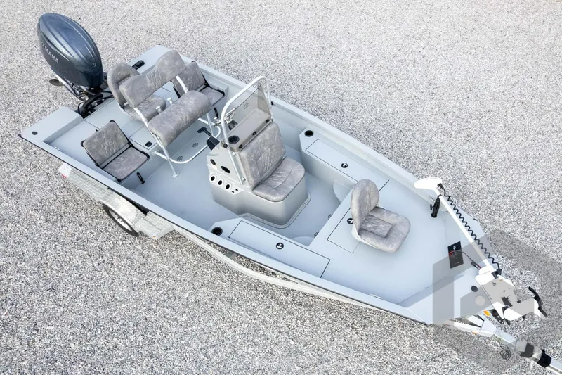 Slide: The Image of 2026 G3 Bay 19 GX boat on trailer, featuring multiple seats and motor. - 63