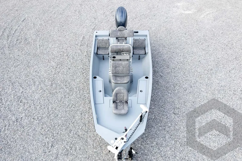 Slide: The Image of 2026 G3 Bay 19 GX boat, aerial view, gray interior, gravel background. - 64