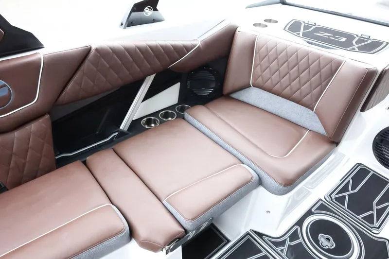 Slide: The Image of 2026 Tigé Z3 boat interior with brown quilted seats and modern design. - 14