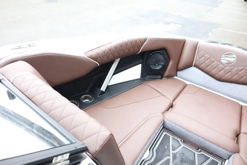 Slide: The Image of 2026 Tigé Z3 boat interior with brown quilted seating and speaker system. - 15