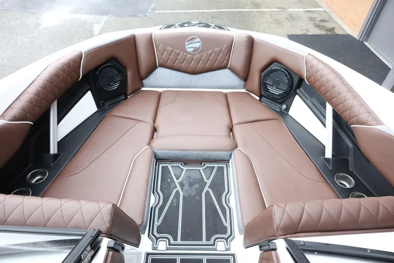 Slide: The Image of 2026 Tigé Z3 boat interior with brown leather seating and modern design. - 17