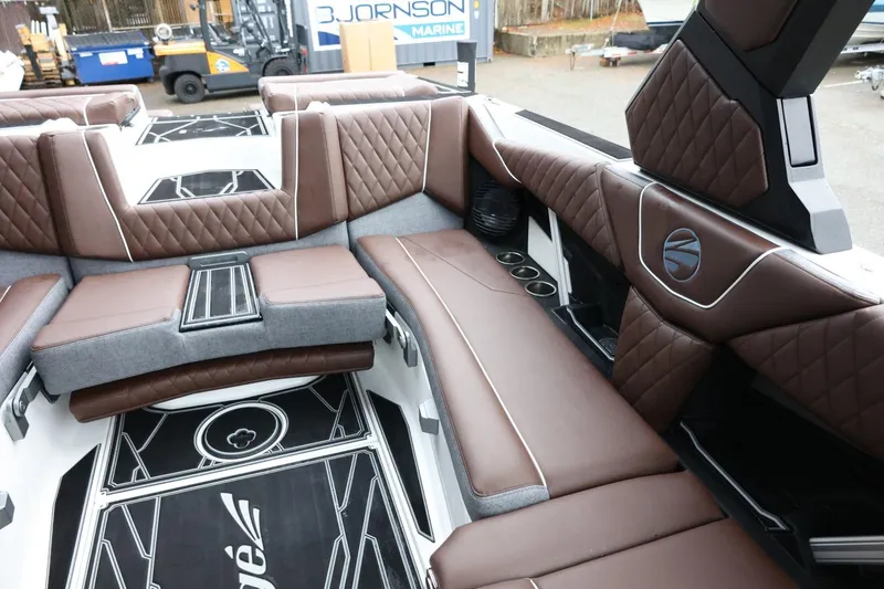 Slide: The Image of 2026 Tigé Z3 boat interior with luxurious brown leather seating and modern design. - 23