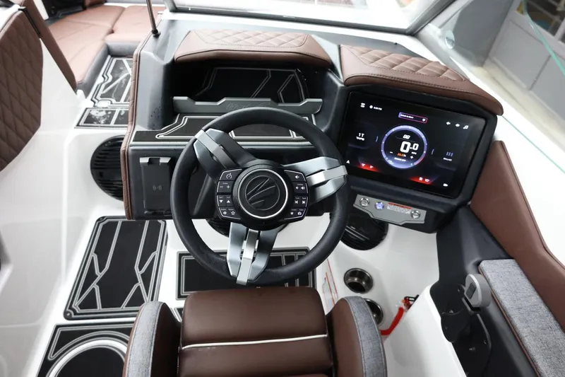 Slide: The Image of 2026 Tigé Z3 boat interior with modern steering wheel and digital dashboard display. - 27
