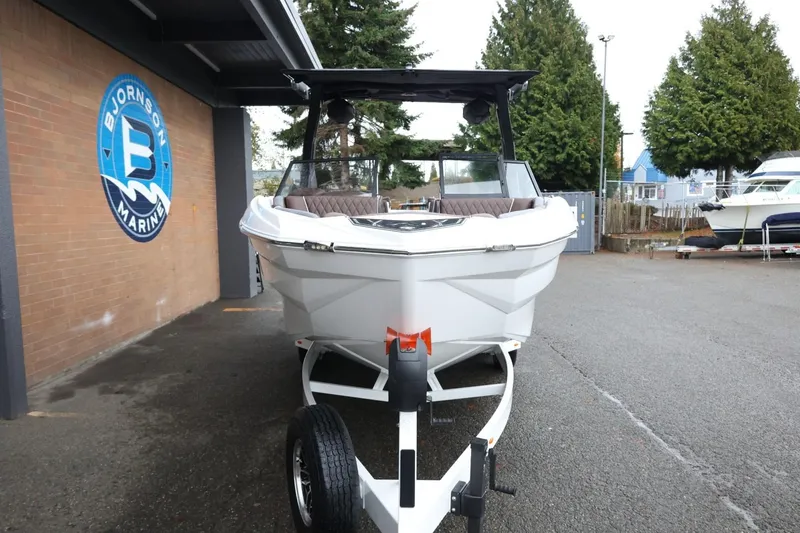 Slide: The Image of 2026 Tigé Z3 boat on trailer at Bjornson Marine dealership. - 3