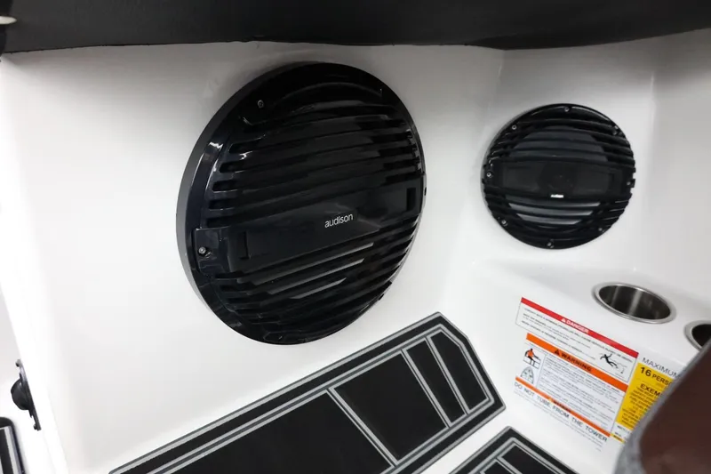 Slide: The Image of 2026 Tigé Z3 boat interior with Audison speakers and safety labels. - 39