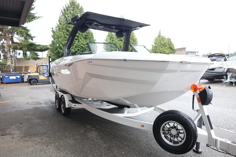 Slide: The Image of 2026 Tigé Z3 boat on trailer, parked outdoors, showcasing sleek design and modern features. - 4