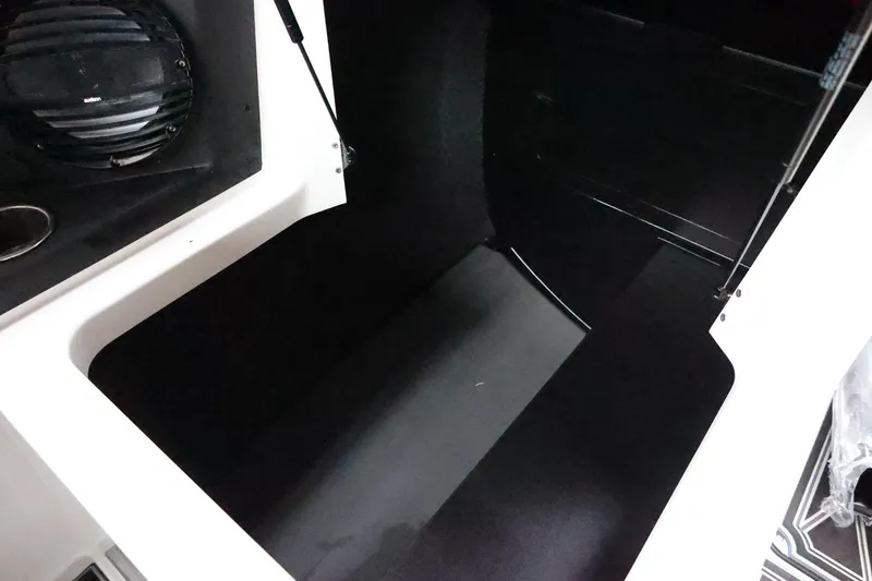 Slide: The Image of 2026 Tigé Z3 boat storage compartment with speaker and cup holder. - 41