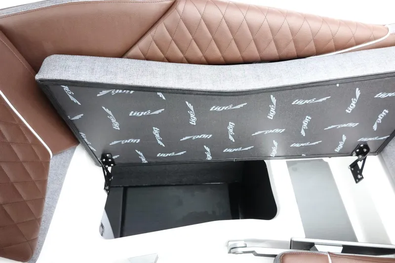 Slide: The Image of 2026 Tigé Z3 boat interior storage compartment with brown and gray upholstery. - 43