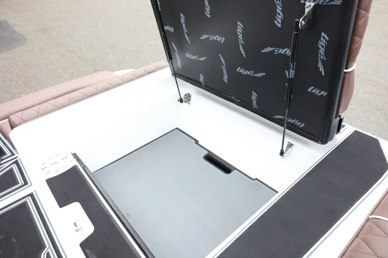 Slide: The Image of 2026 Tigé Z3 boat storage compartment with open lid and hydraulic supports. - 46