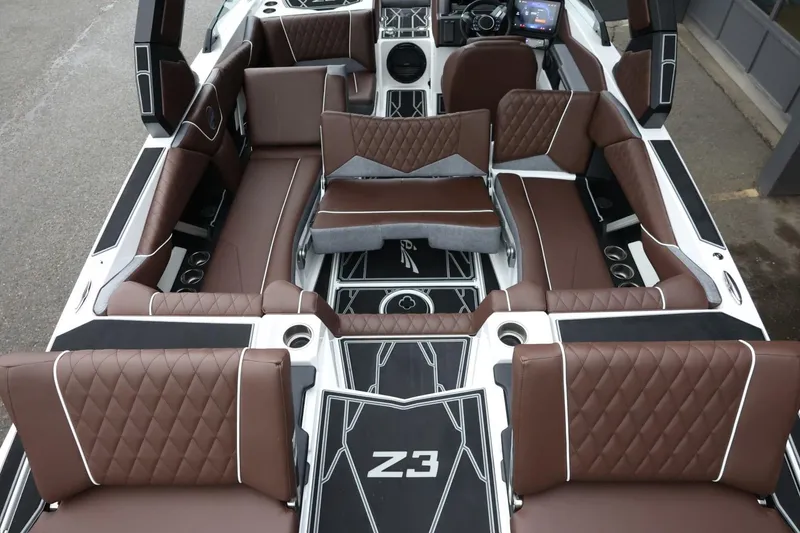 Slide: The Image of 2026 Tigé Z3 boat interior with luxurious brown seating and modern dashboard. - 50