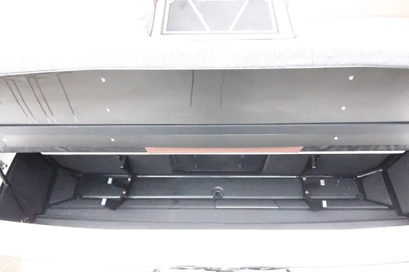 Slide: The Image of 2026 Tigé Z3 boat storage compartment, open and empty, showcasing interior space. - 53