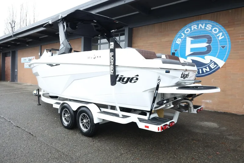 Slide: The Image of 2026 Tigé Z3 boat on trailer at Bjornson Marine dealership. - 8