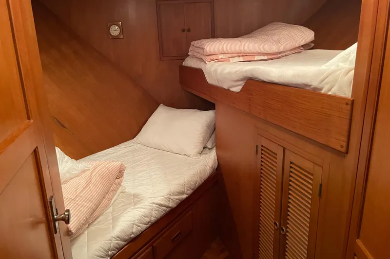 Slide: The Image of Cozy cabin with wooden bunk beds in 1985 Nova 40 Sundeck Aft Cabin yacht. - 17