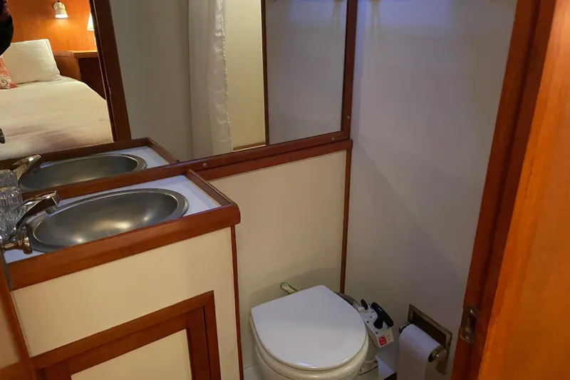 Slide: The Image of Bathroom in 1985 Nova 40 Sundeck Aft Cabin with sink and toilet. - 25