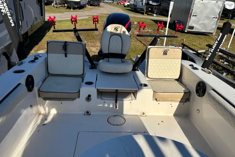 Slide: The Image of 2021 Carolina Skiff 26 Ultra Elite boat interior with seating and rod holders. - 11