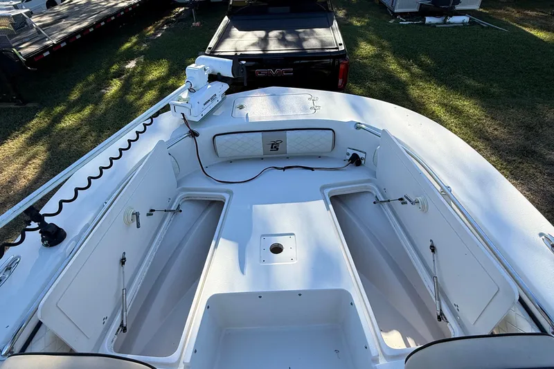 Slide: The Image of 2021 Carolina Skiff 26 Ultra Elite boat deck with open storage compartments. - 20