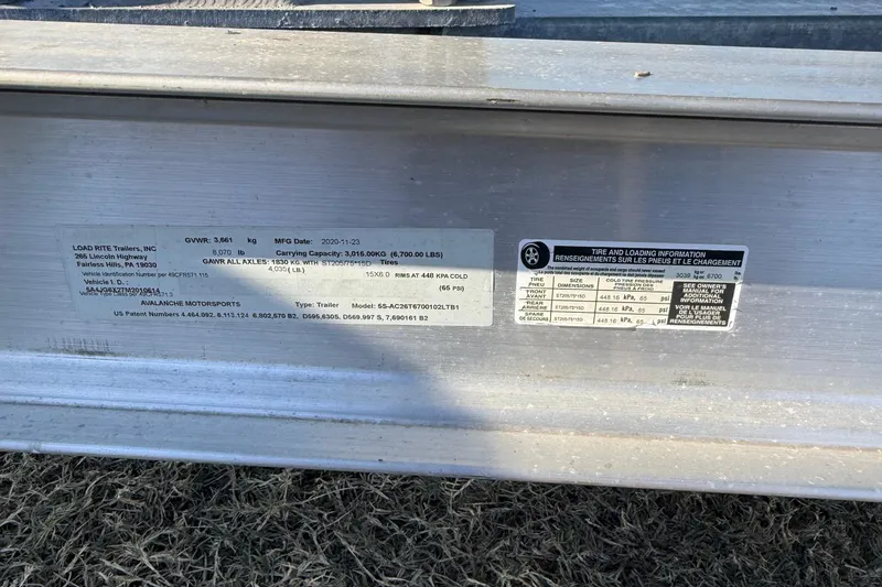 Slide: The Image of 2021 Carolina Skiff 26 Ultra Elite trailer label with specifications and loading information. - 23