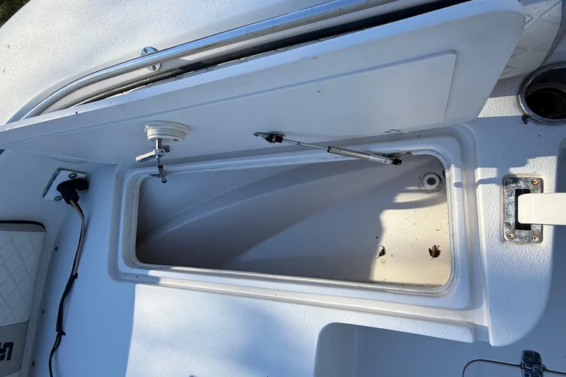 Slide: The Image of Open storage compartment on 2021 Carolina Skiff 26 Ultra Elite boat deck. - 24