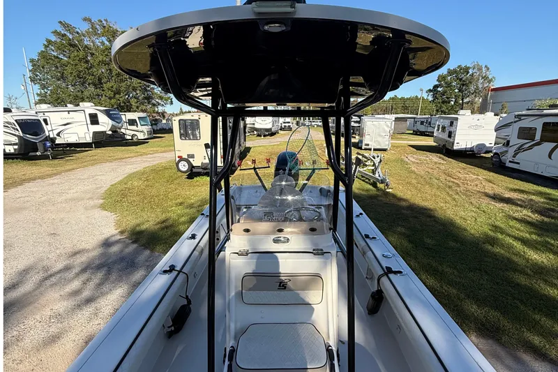 Slide: The Image of 2021 Carolina Skiff 26 Ultra Elite boat in RV park, showcasing interior and T-top. - 25
