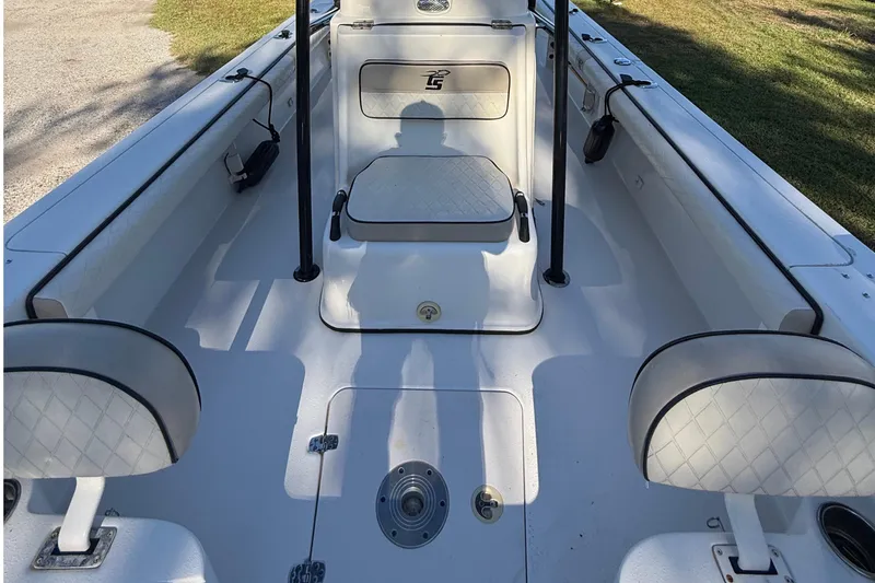 Slide: The Image of 2021 Carolina Skiff 26 Ultra Elite boat interior with seating and storage compartments. - 26