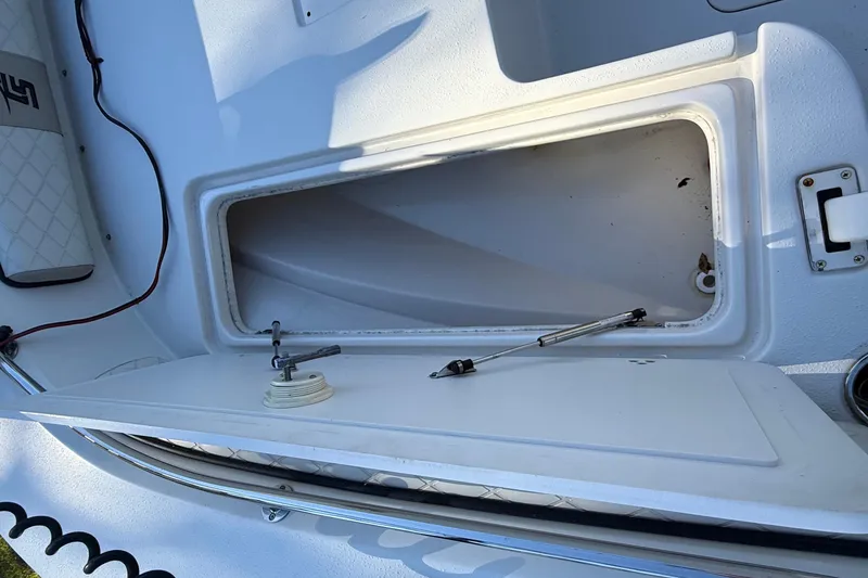 Slide: The Image of Open storage compartment on 2021 Carolina Skiff 26 Ultra Elite boat. - 27