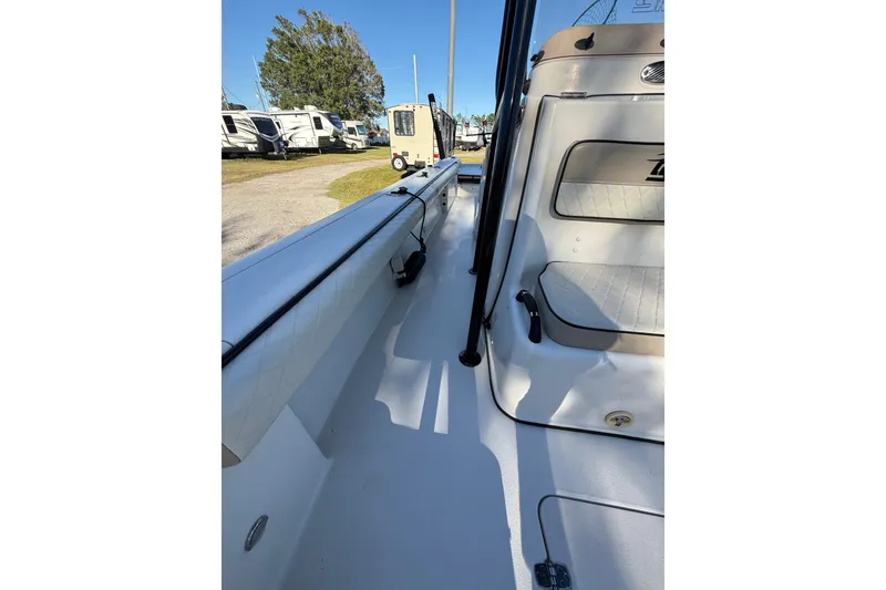 Slide: The Image of 2021 Carolina Skiff 26 Ultra Elite boat interior with seating and storage. - 28