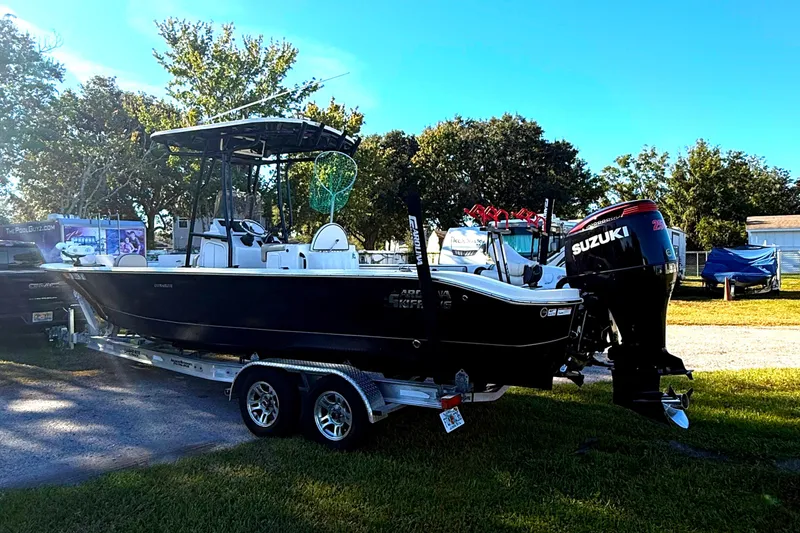 Slide: The Image of 2021 Carolina Skiff 26 Ultra Elite boat on trailer with Suzuki outboard motor. - 3