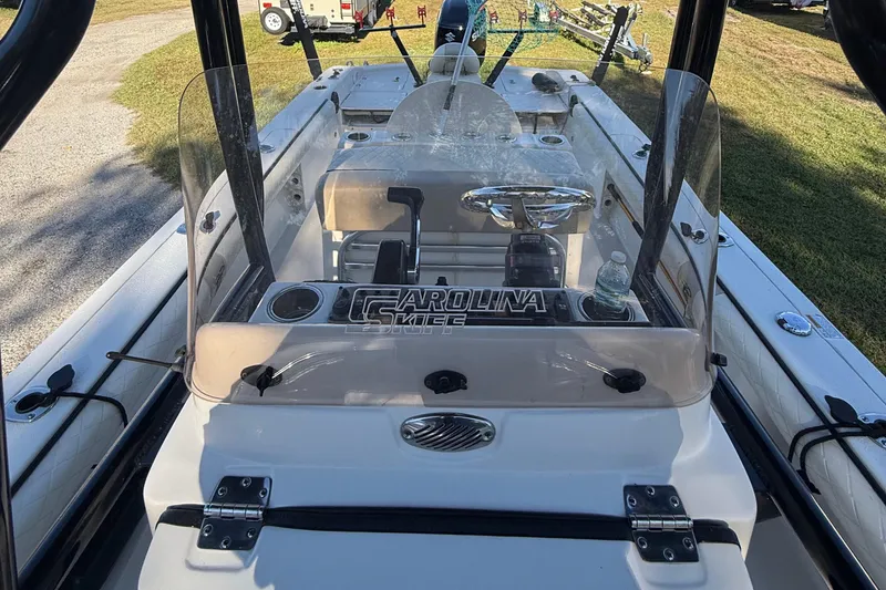 Slide: The Image of 2021 Carolina Skiff 26 Ultra Elite boat interior with steering console and windshield. - 32