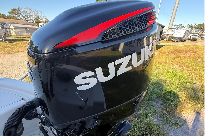 Slide: The Image of Suzuki outboard motor on 2021 Carolina Skiff 26 Ultra Elite boat. - 35