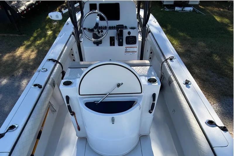 Slide: The Image of 2021 Carolina Skiff 26 Ultra Elite boat interior with steering console and seating. - 38