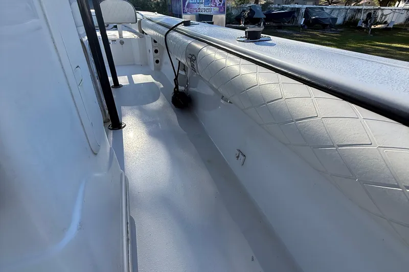 Slide: The Image of 2021 Carolina Skiff 26 Ultra Elite boat interior with white textured flooring and seating. - 43