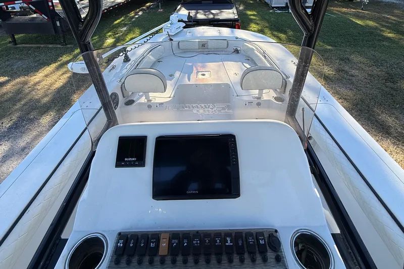 Slide: The Image of 2021 Carolina Skiff 26 Ultra Elite boat dashboard with Garmin display and controls. - 46