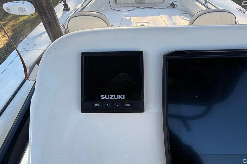 Slide: The Image of 2021 Carolina Skiff 26 Ultra Elite dashboard with Suzuki display screen. - 47