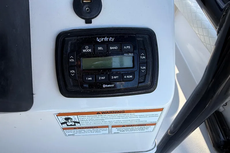 Slide: The Image of Infinity stereo system on 2021 Carolina Skiff 26 Ultra Elite boat dashboard. - 49
