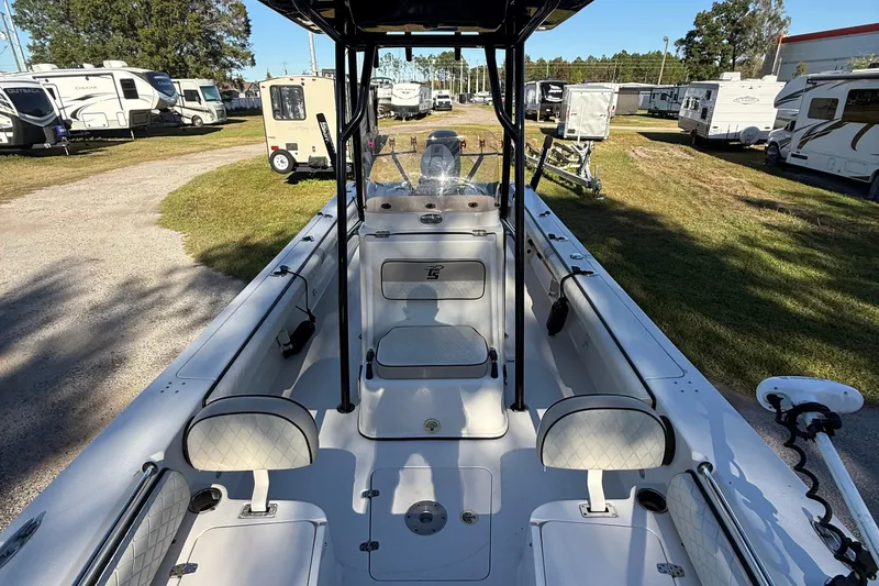 Slide: The Image of 2021 Carolina Skiff 26 Ultra Elite boat interior, parked among RVs and trailers. - 53