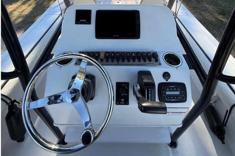 Slide: The Image of 2021 Carolina Skiff 26 Ultra Elite boat console with steering wheel and controls. - 54