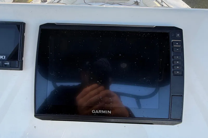 Slide: The Image of Garmin navigation system on 2021 Carolina Skiff 26 Ultra Elite boat dashboard. - 55