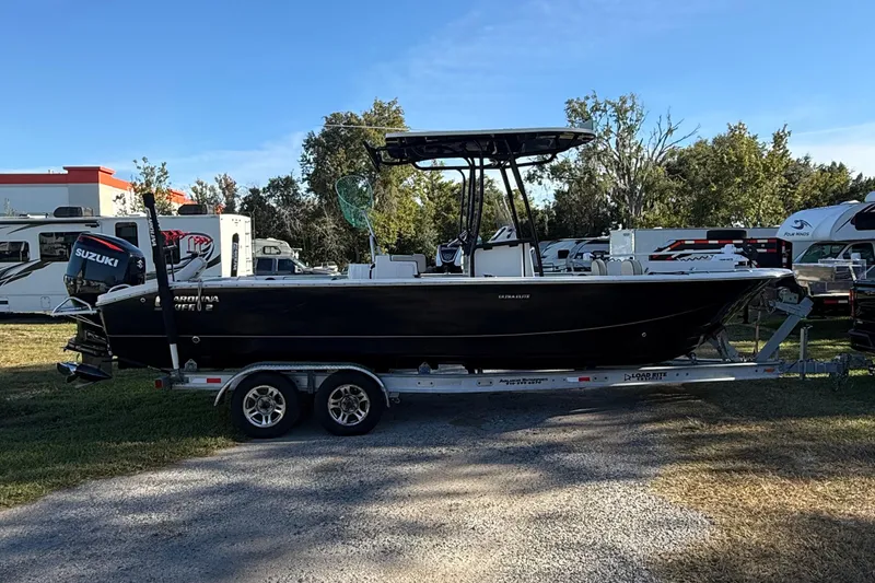 Slide: The Image of 2021 Carolina Skiff 26 Ultra Elite boat on trailer, parked outdoors. - 6