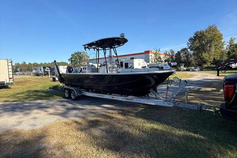 Slide: The Image of 2021 Carolina Skiff 26 Ultra Elite boat on trailer in outdoor setting. - 8