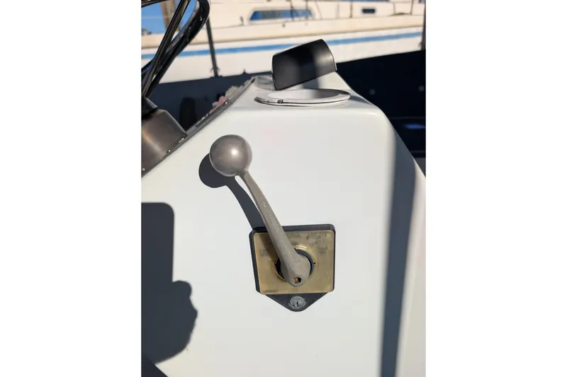 Slide: The Image of Throttle control lever on a 1989 Duffy 20 boat dashboard. - 14