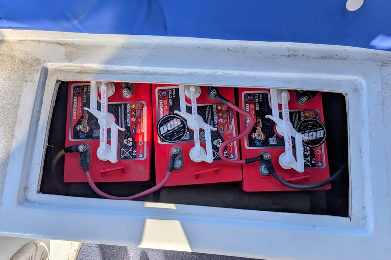 Slide: The Image of Batteries in a 1989 Duffy 20 boat, showing red deep cycle units. - 6
