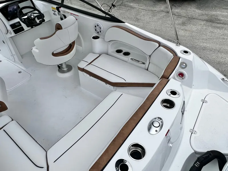 Slide: The Image of Interior of Stingray 211DC boat, luxurious seating and helm console. - 11