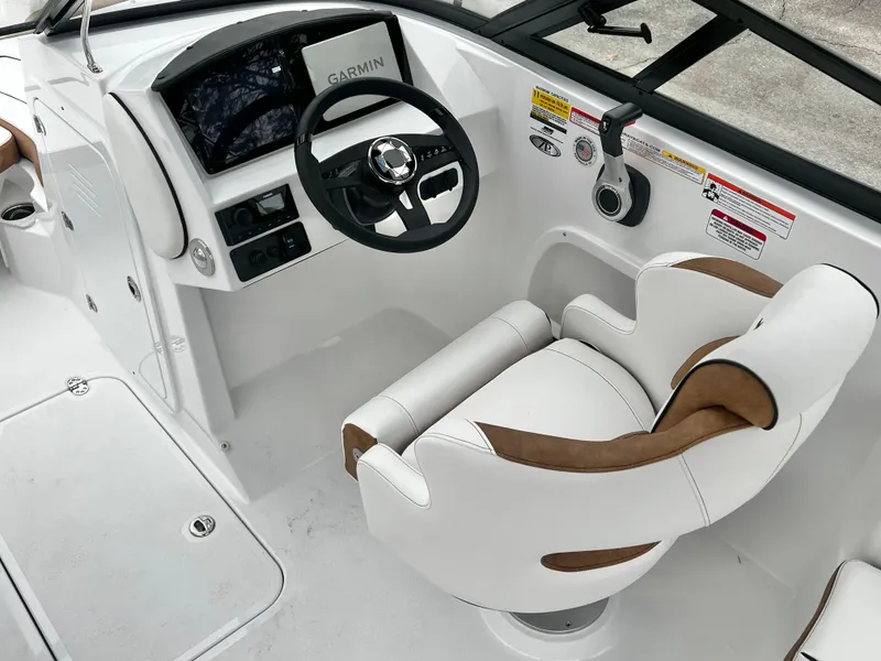 Slide: The Image of Interior of 2026 Stingray 211DC with helm console and seat. - 13
